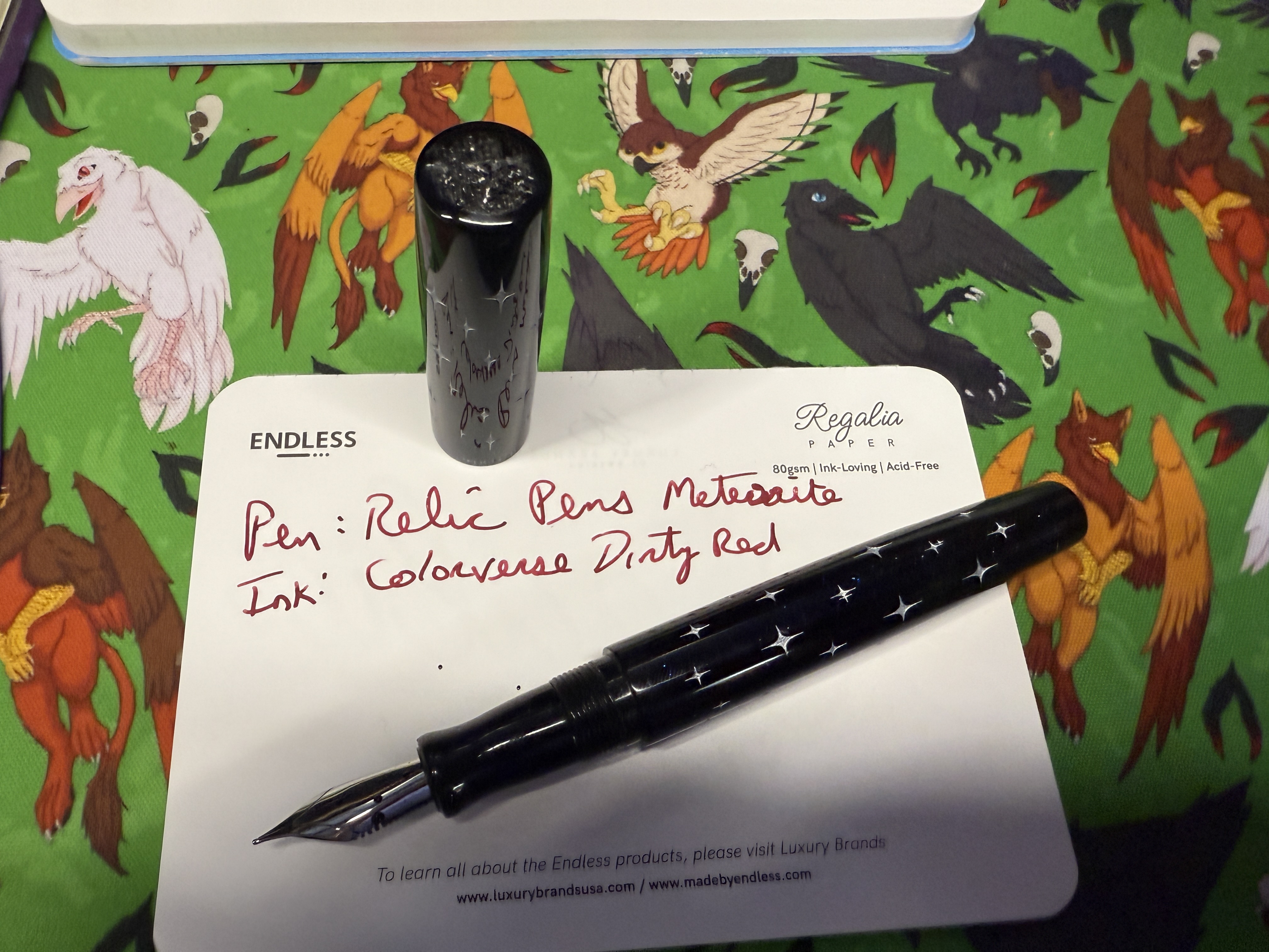 Image showing Relic Pen uncapped with writing sample.