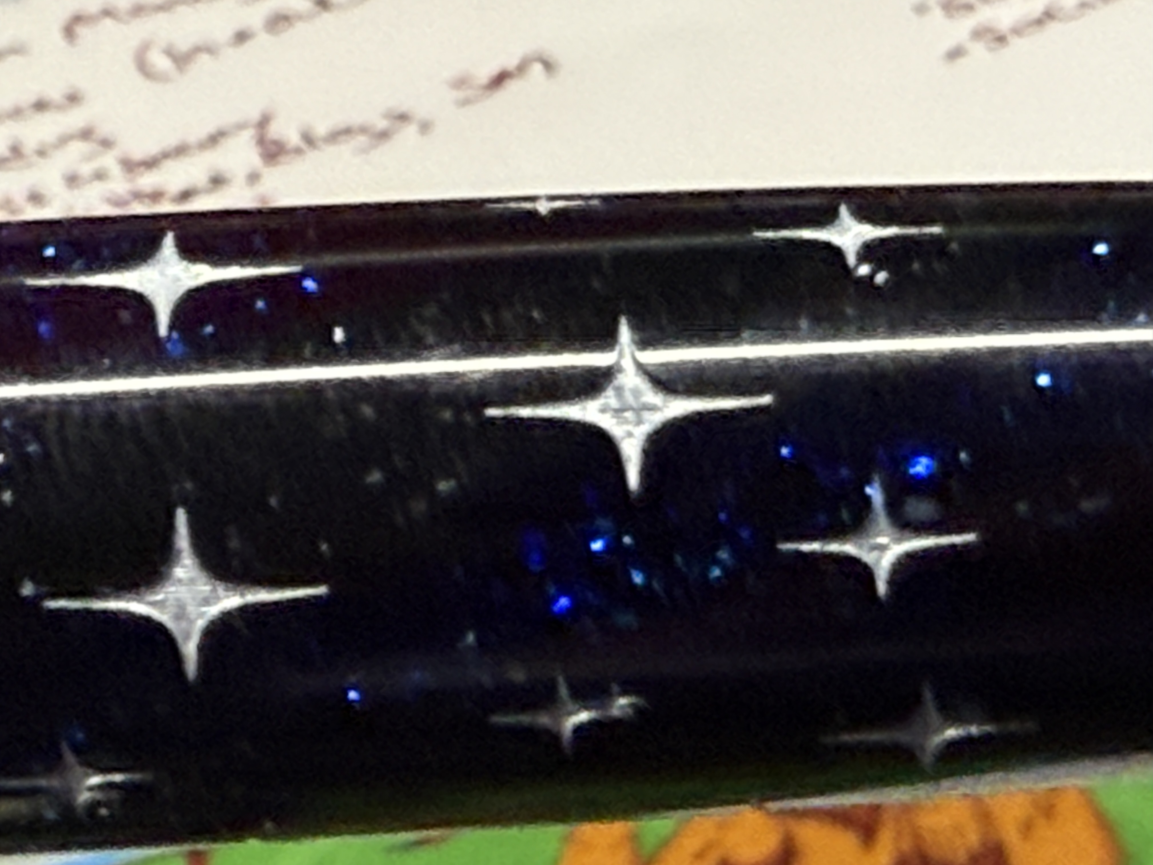Barrel of Relic Pen showing the cut stars and the blue sparkle.